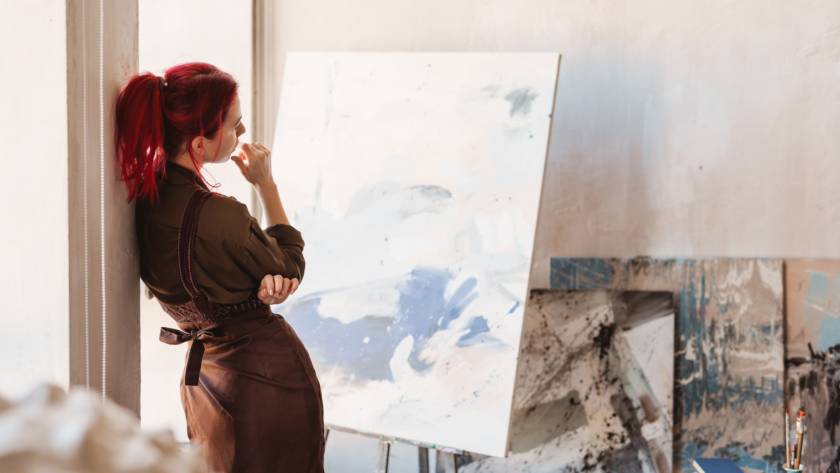 Young creative woman artist standing